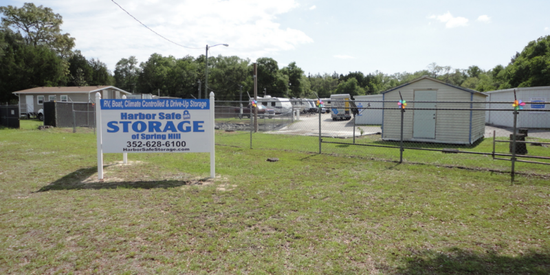 business sign with boats parked in the background spring hill fl